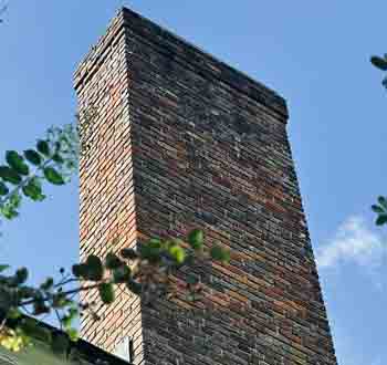 Chimney Sweep - Photo of a brick chimney.