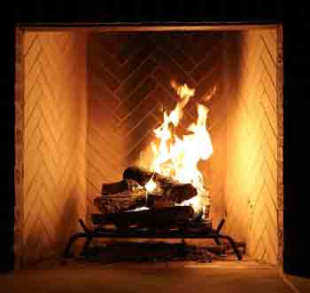 Stove & Fireplace Cleaning - Photo of a fire burning in a fireplace.